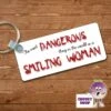 Rectangular Keyring Showing "The Most Dangerous...Smiling Woman" 2 Rectangular Keyring Showing "The Most Dangerous...Smiling Woman" -CheekyNeep Store rectangular plastic two sided keyring smiling woman CN 0008 0009 by cheekyneep.com