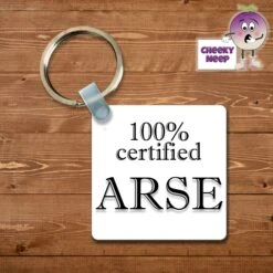 Square Keyring Showing "100% Certified Arse"