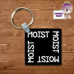 Square Keyring Showing "Moist"