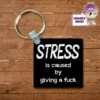Square Keyring Showing "Stress Is Caused By Giving A Fuck" -CheekyNeep Store square plastic two sided keyring stress is caused by CN 0007 0176 by cheekyneep.com