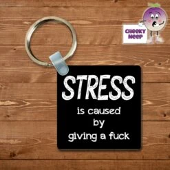 Square Keyring Showing "Stress Is Caused By Giving A Fuck"