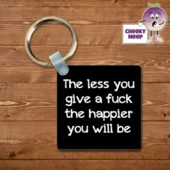 Square Keyring Showing "The Less You Give A Fuck The Happier You Will Be"